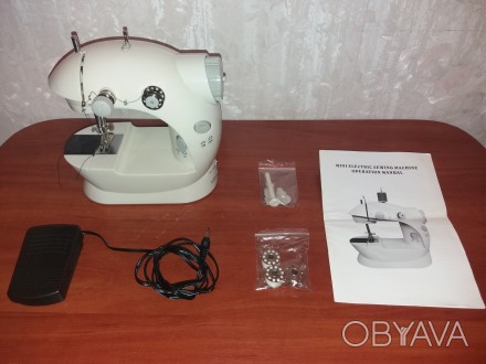 Продам портативную швейную машинку портативная Mini Sewing Machine SM-202A.

M. . фото 1