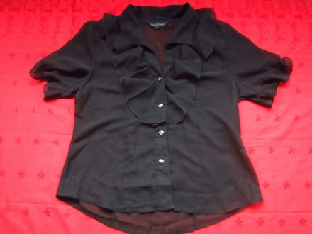 Чёрная женская блузка .ПОГ 54см,ПОТ 48,5см.Длина блузки по спинке 64см.. . фото 2