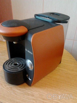 Кофеварка TASSIMO использует капсулы для заваривания ароматного кофе,крепкого эк. . фото 1