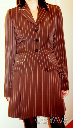 Легкий модный костюм жакет с юбкой из приятной ткани.Абсолютно новый.
Производс. . фото 1
