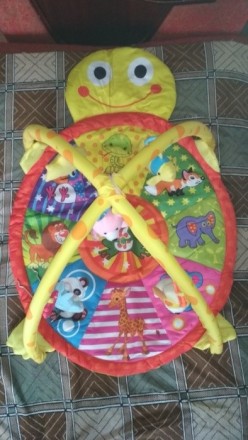 Продам новый розвивающий коврик-черепашку с подвесными мягкими игрушками-погрему. . фото 5