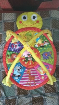 Продам новый розвивающий коврик-черепашку с подвесными мягкими игрушками-погрему. . фото 4