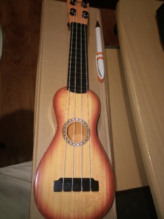 Новая детская гавайская гитара. Изготовлена в Китае. Материал - пластик. Местопо. . фото 2