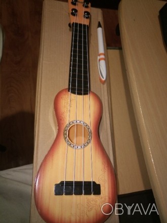 Новая детская гавайская гитара. Изготовлена в Китае. Материал - пластик. Местопо. . фото 1