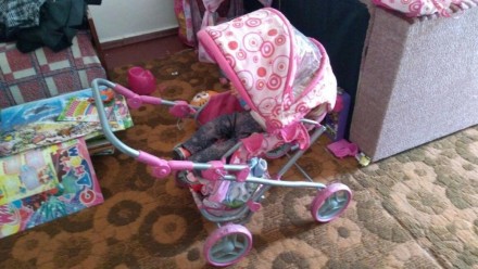 Продам коляску для игрушек в нормальном состоянии, розовая, сделана под настоящу. . фото 4