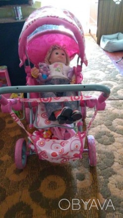 Продам коляску для игрушек в нормальном состоянии, розовая, сделана под настоящу. . фото 1