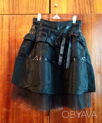 Нарядная юбка в идеальном состоянии. На 9-11 лет (талия 60-62).
Состав: 35% лен. . фото 1
