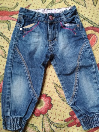 Новенькі джинси, котон. На вік приблизно 9 міс - 1 рік. Знижу джинсів манжети.. . фото 4