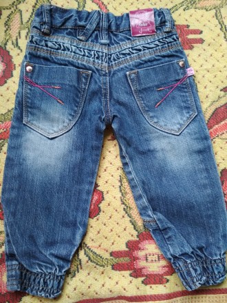 Новенькі джинси, котон. На вік приблизно 9 міс - 1 рік. Знижу джинсів манжети.. . фото 3